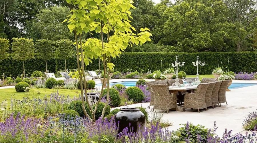 A modern outdoor furniture set as part of a luxury garden design.